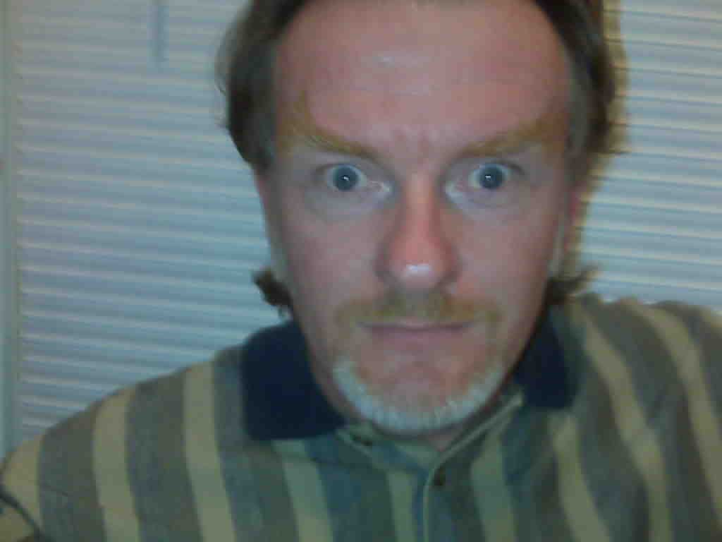 Tom peers at me, unfazed, after guzzling sixteen Moose Drool Porters.