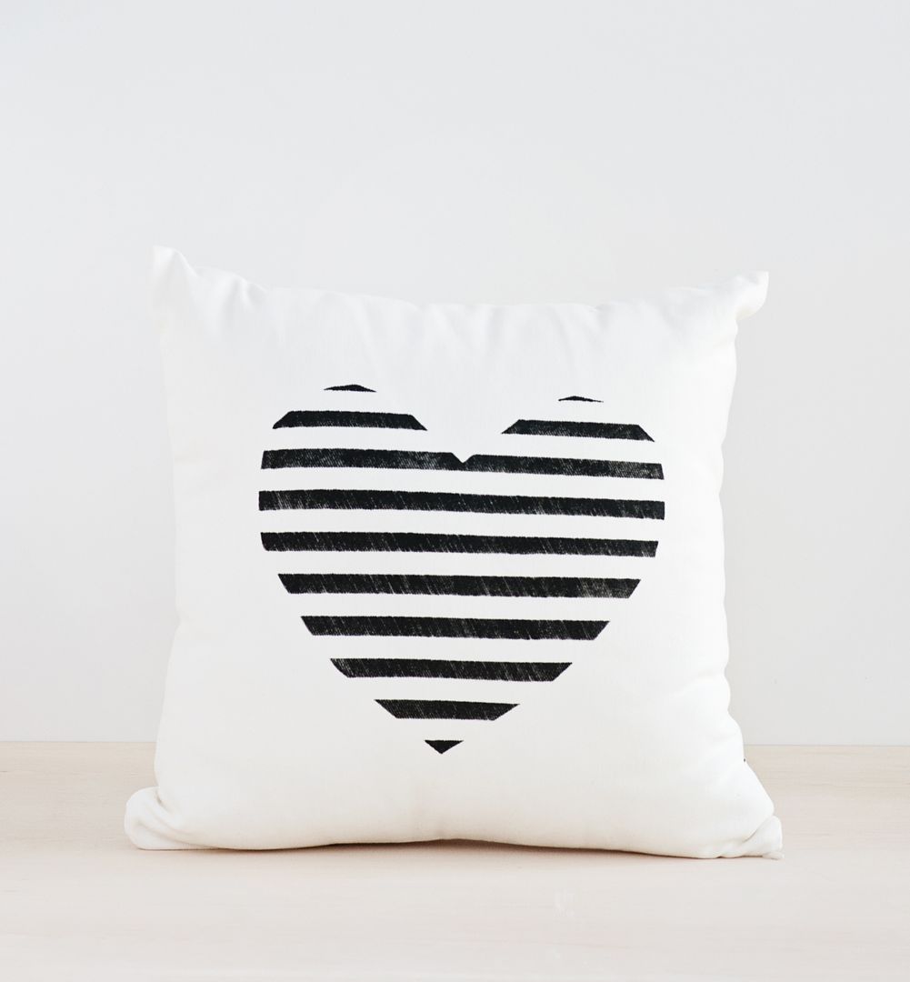 Black and white home decor: Black and white striped heart pillow at the Cool Mom Picks Indie Shop