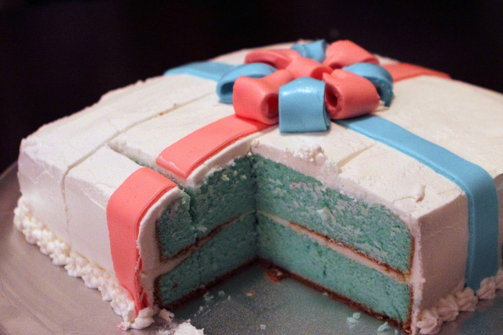 Gift wrapped gender reveal cake 