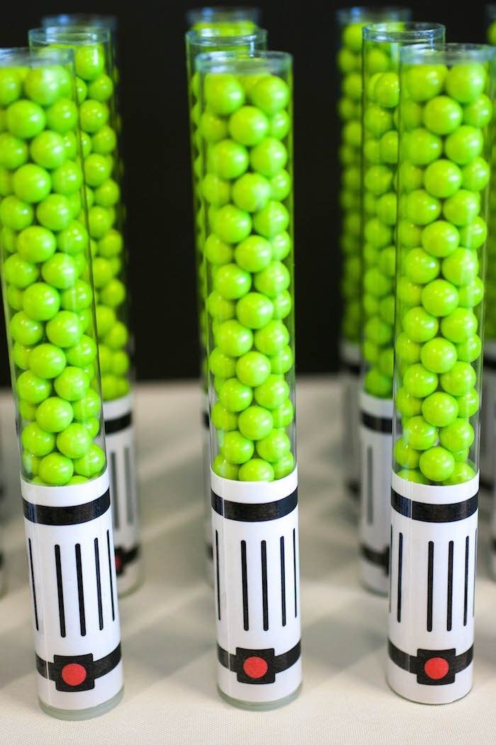 Star Wars party idea: Fill a candy tube with Sixlets and add a printable handle to make a delicious Lightsaber party favor | Petite Party Studio