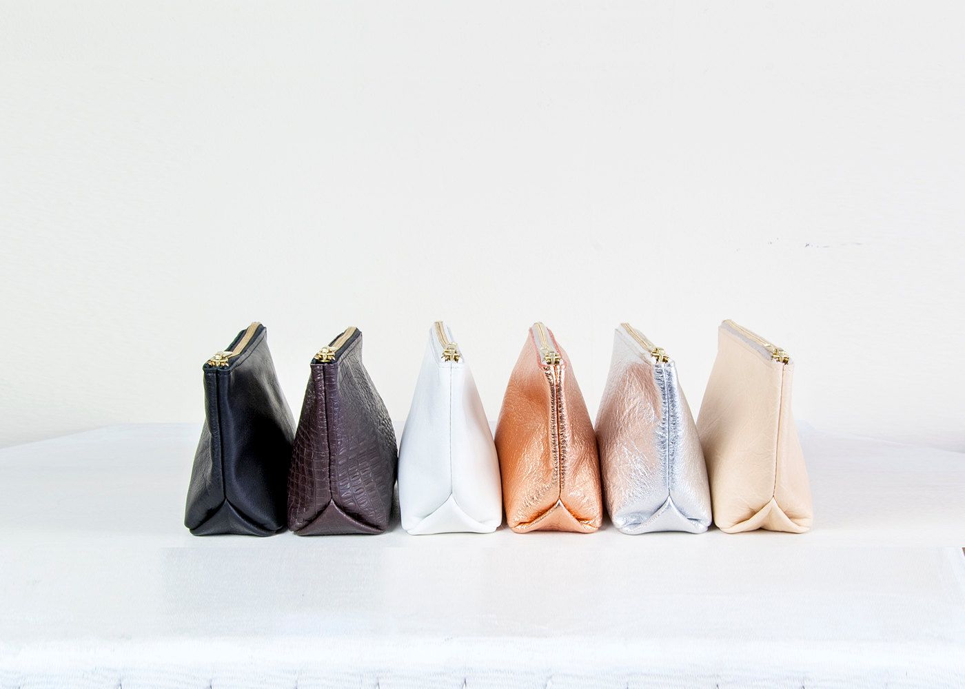Metallic cosmetics bag collection from Gift Shop Brooklyn on Etsy