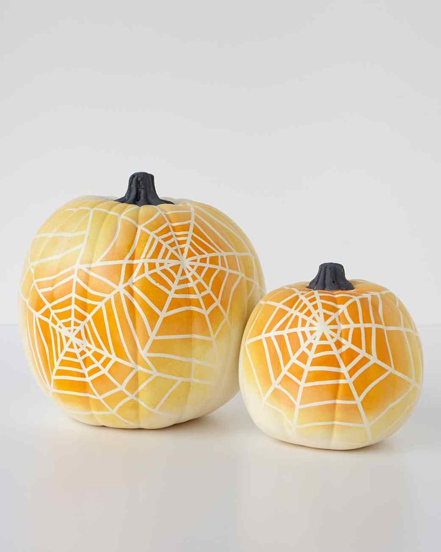Easy no-carve pumpkin ideas: Spiderweb ombre pumpkins via Martha Stewart