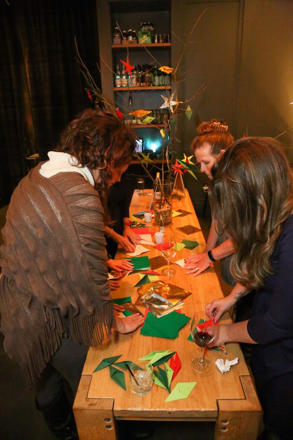 Fun holiday party activity: set up a gift tag craft station. We tried origami gift tags. Fun! | Cool Mom Picks