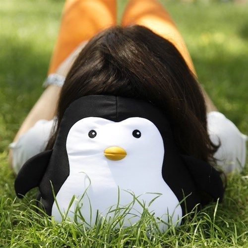 Penguin convertible travel pillow: Unzips and flips from a stuffed penguin to a neck rest travel pillow