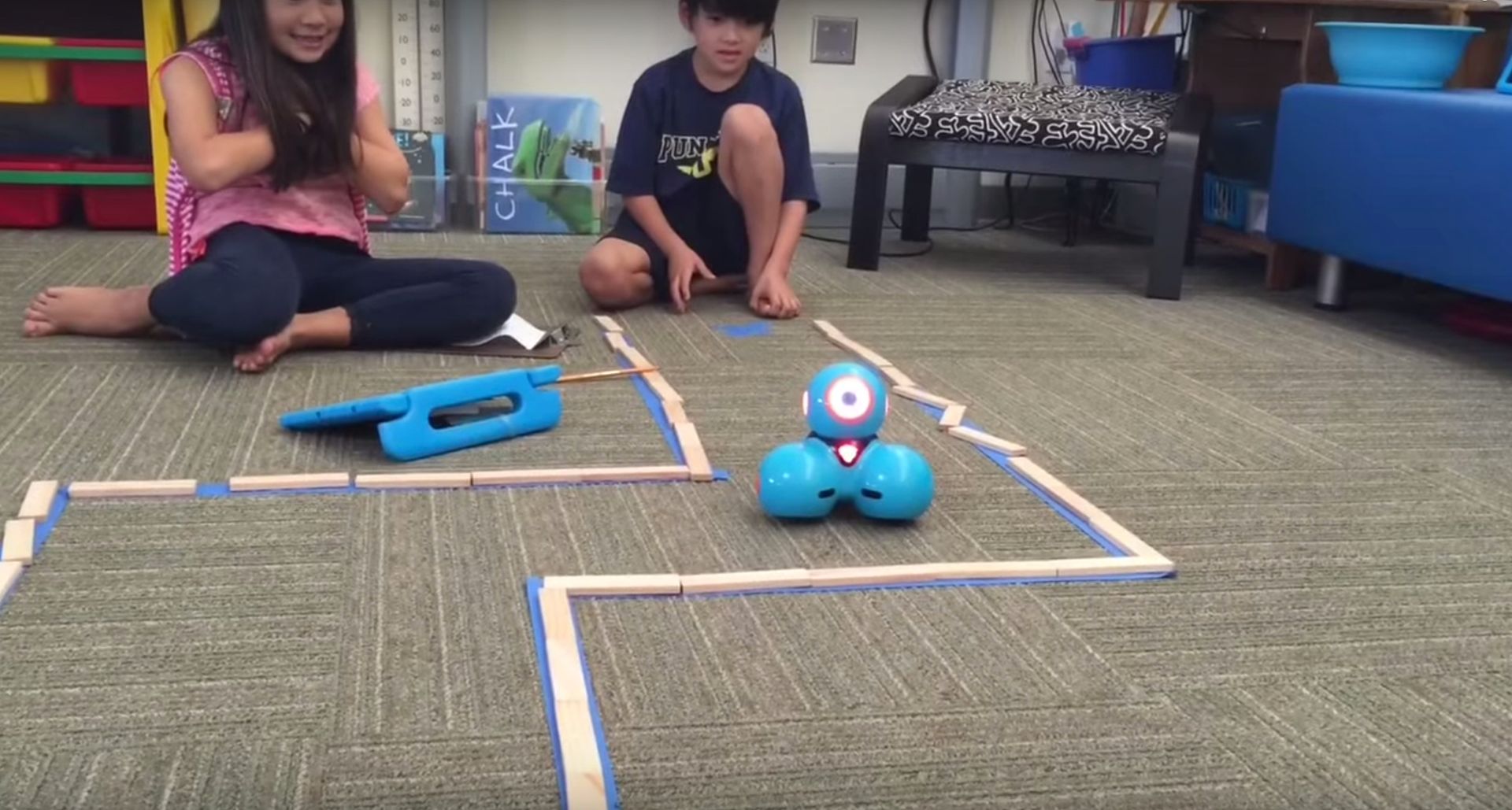 Coding projects with kids: Dot and Dash robots navigate a masking tape maze