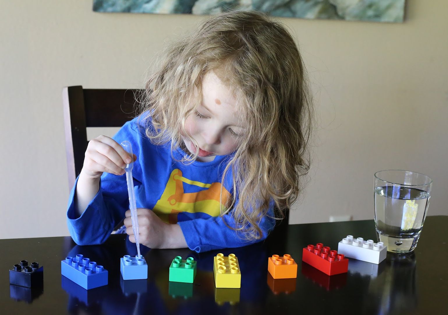 4 great activities to help kids build fine motor skills using LEGO like filling holes with water using a medicine dropper | ideas via Fun at Home With Kids