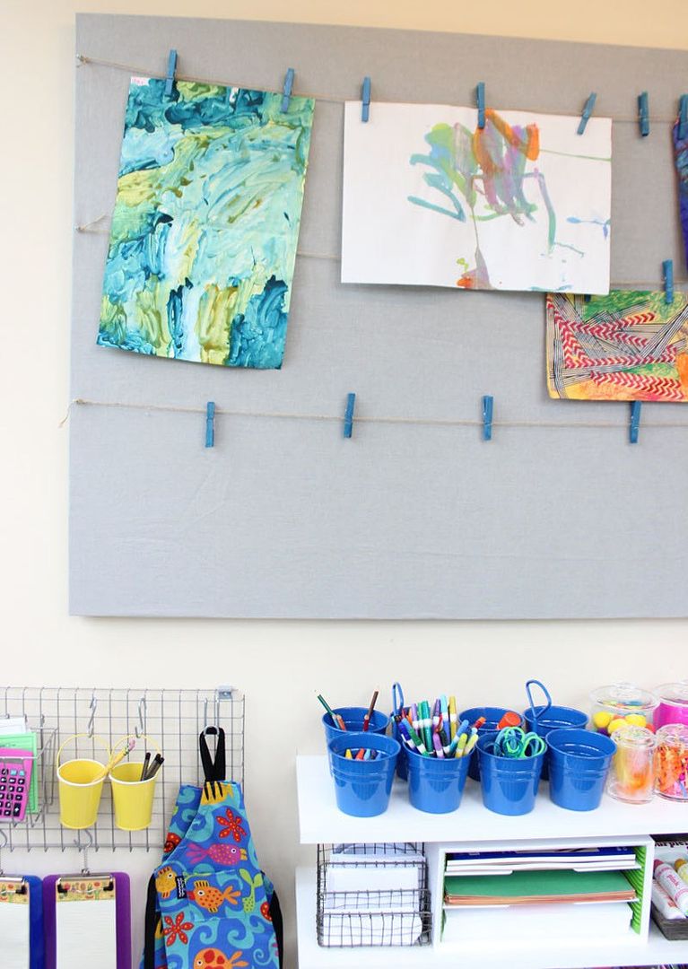Kids' craft space organization tips: Clothespins on twine make the world's easiest display solution
