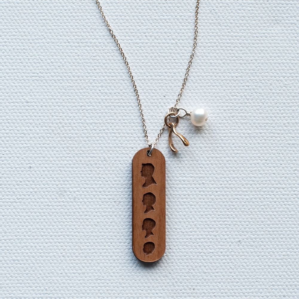 Personalized silhouette gifts: wooden laser etched silhouette necklace at Le Papier Studio