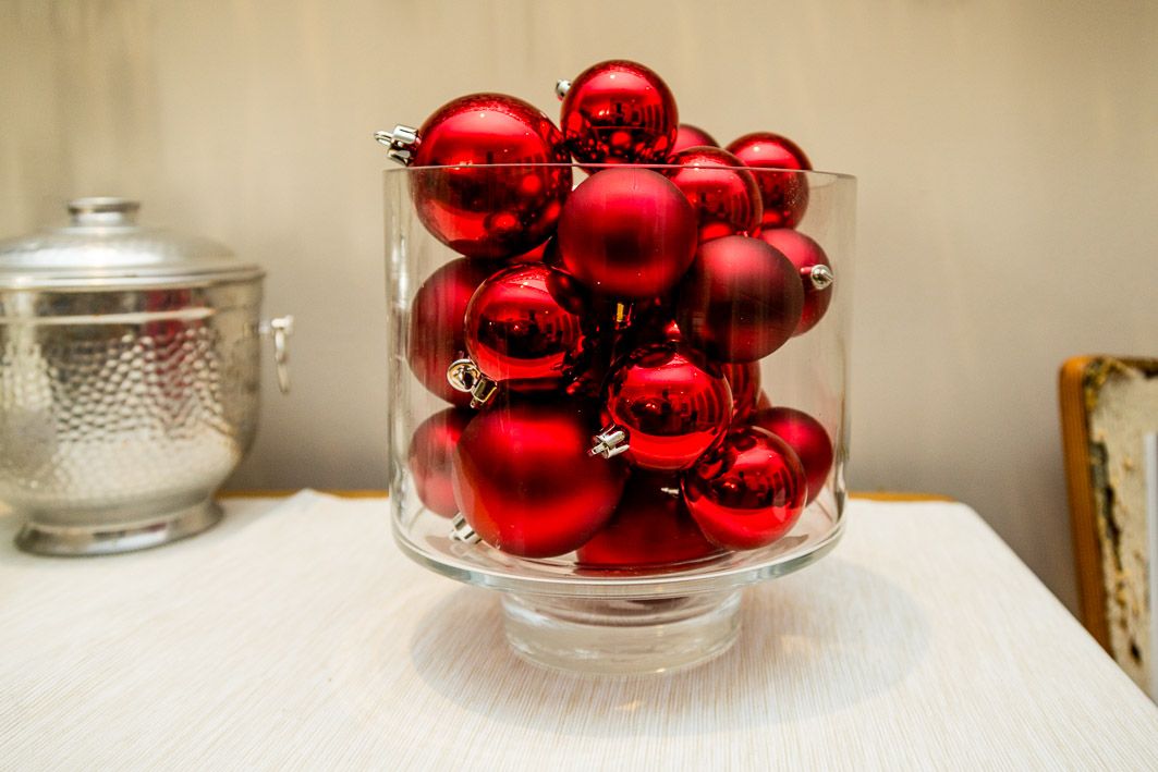 How to display ornaments: Use an extra wide vase and pile over the top