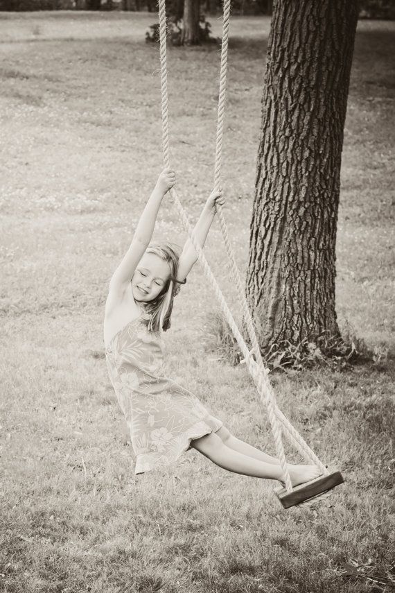 A wooden tree swing like they used to make