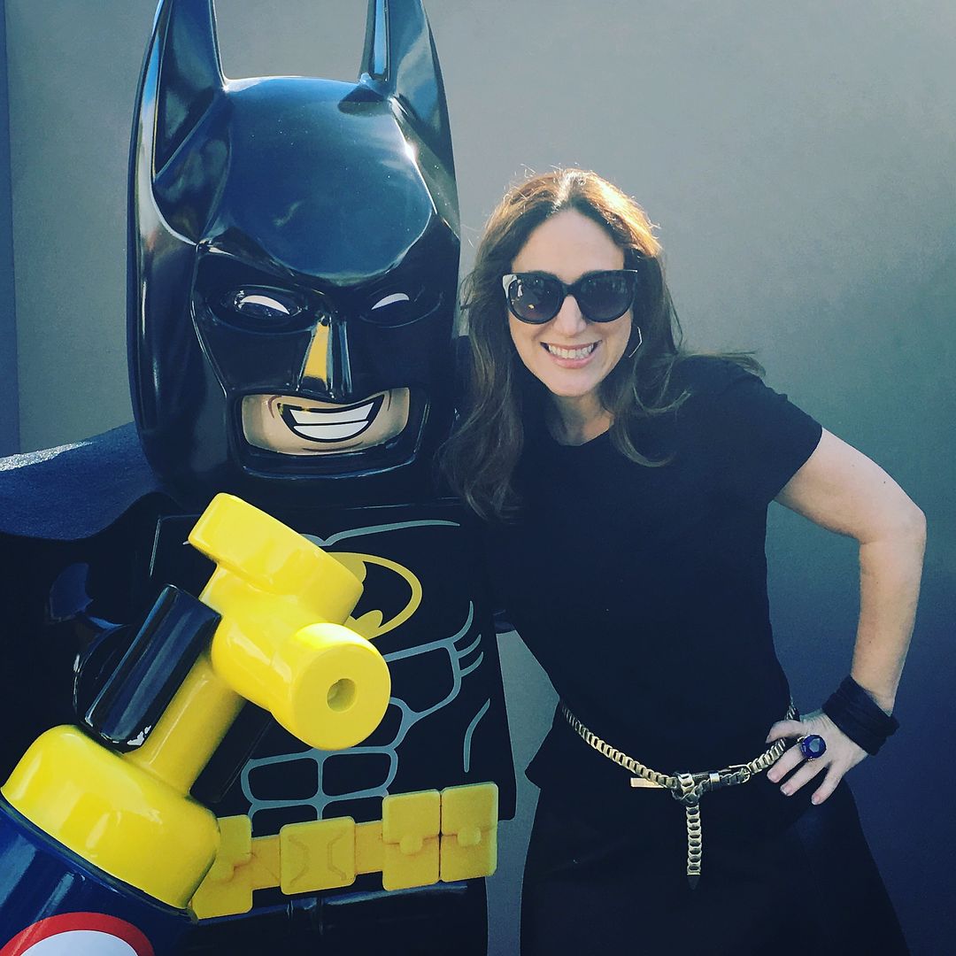Liz Gumbinner of Cool Mom Picks poses with the star of the LEGO Batman Movie at the premiere party