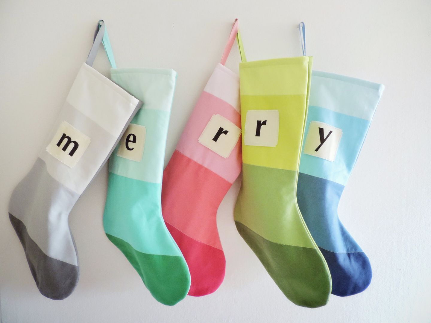 Baby's first Christmas gifts: Handmade modern stockings with monograms from Good Wishes Quilts