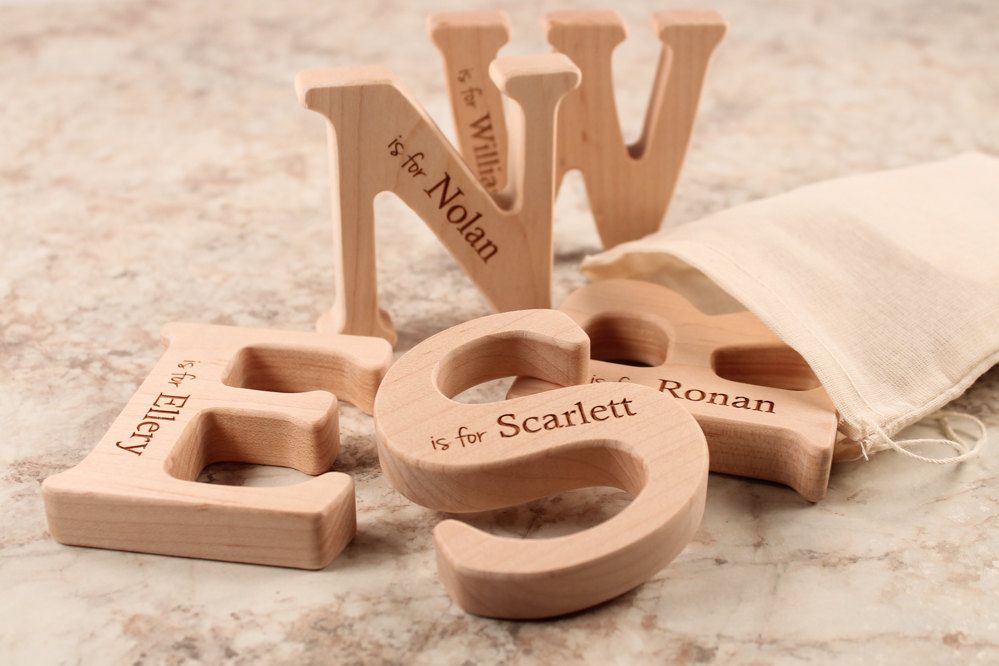 Cool gifts for kids under $15; Personalized wooden letter teethers at Smiling Tree Toys