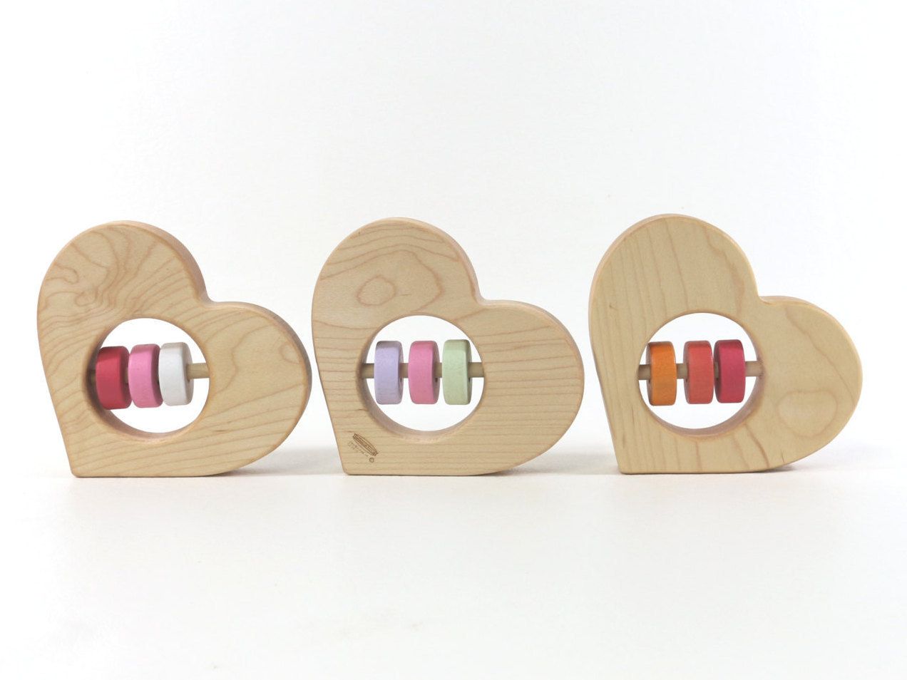 Handmade wooden heart rattles in your choice of colors: Cute Valentine's Day gift ideas for babies